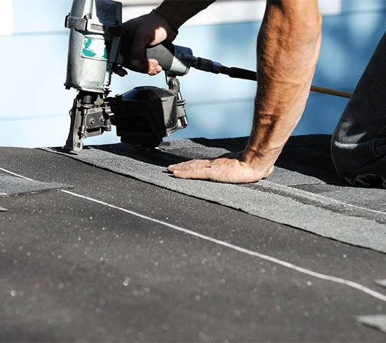 Commercial roofing crew on a flat roof in Austin