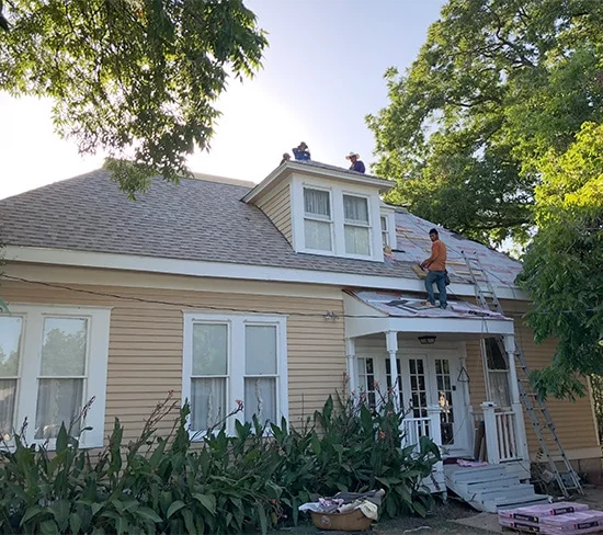 Residential roofing crew working in Austin